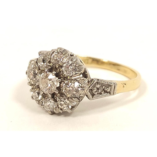 121 - Diamond nine stone cluster ring in gold '18ct platinum' 1930's. Size 'K½'. 3.4g