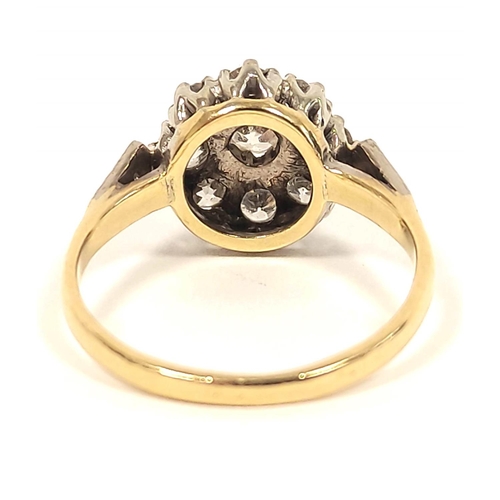 121 - Diamond nine stone cluster ring in gold '18ct platinum' 1930's. Size 'K½'. 3.4g