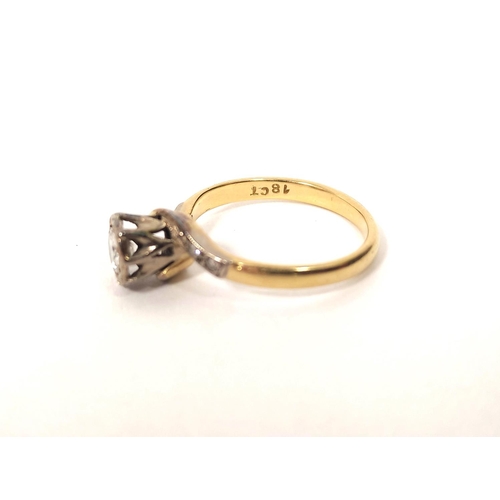 128 - Diamond solitaire cross-over ring in gold, '18ct' size 'L'