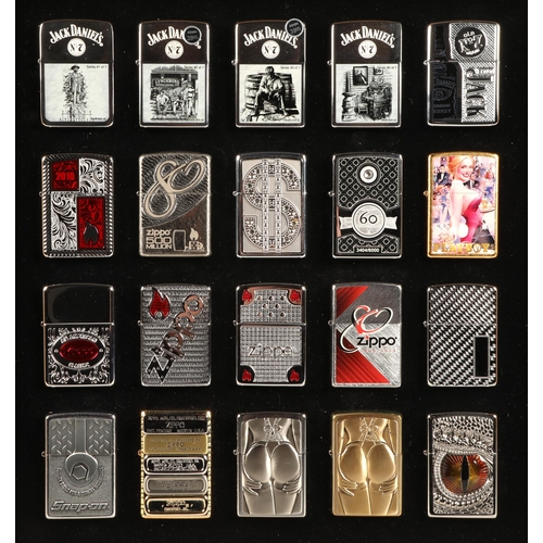 166 - Twenty Zippo lighters in display case to include Jack Daniels and Playboy, etc