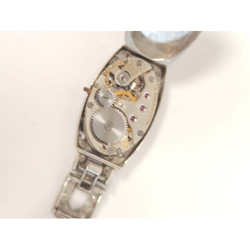 144 - Diamond set evening watch 'all platinum' on 9ct gold bracelet 12.9g and two other items.