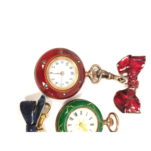 151 - Two Geneva cylinder watches enamelled in wine, red and green, with a bow (3)