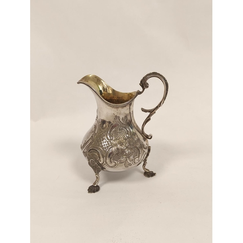 91 - Silver cream jug of pear shape, embossed, by Hyam Hyams, 1872. 195g, 6oz.