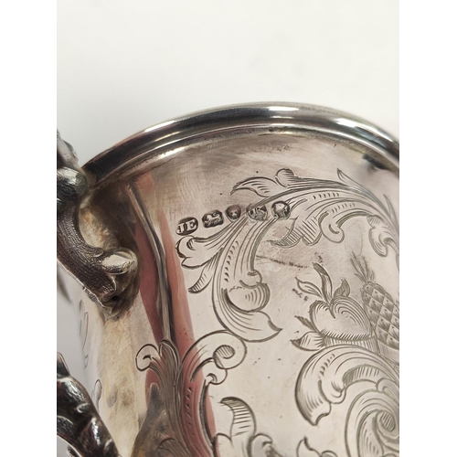 92 - Silver christening mug with engraved scrolls upon similar embossed foot, 1840. 155g, 5oz.