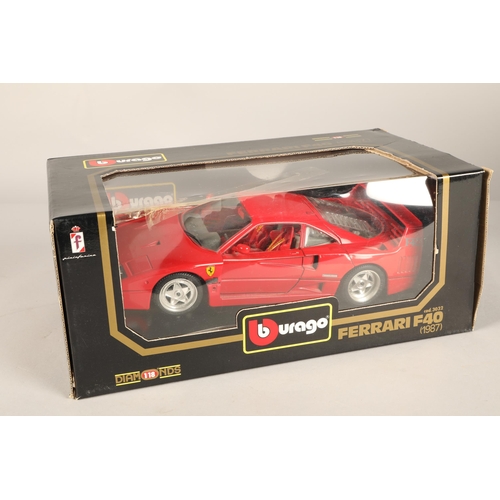 254 - Four boxed Burago models including Ferrari, Jaguar and Porsche