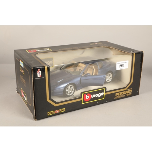 254 - Four boxed Burago models including Ferrari, Jaguar and Porsche