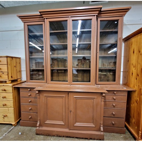 601 - Glazed four door breakfront bookcase over drawers and two door cupboard, approx 235cm x 232cm