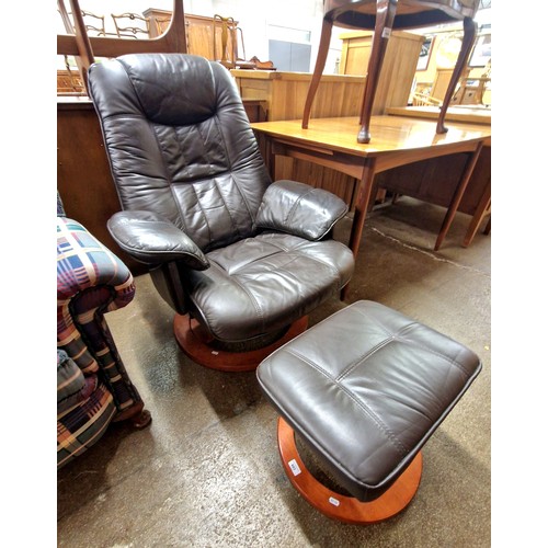 602 - Leather upholstered easy chair with foot stool