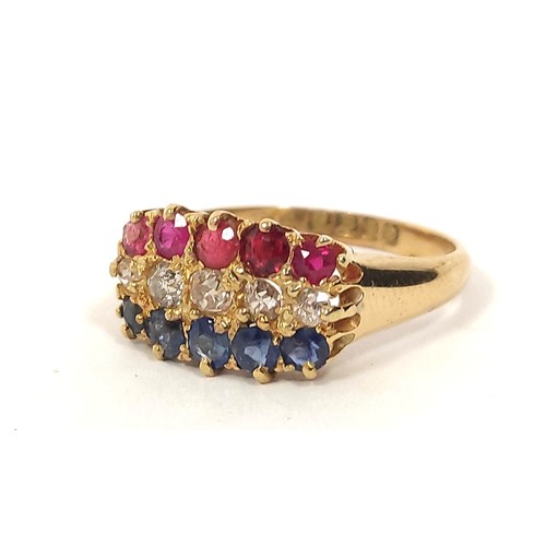 119 - Three row diamond sapphire and ruby ring, in 18ct gold, 1909. 4.1g. Size 'M½'