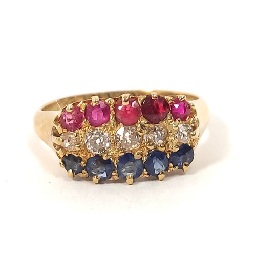 119 - Three row diamond sapphire and ruby ring, in 18ct gold, 1909. 4.1g. Size 'M½'