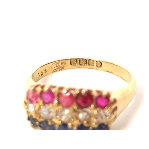 119 - Three row diamond sapphire and ruby ring, in 18ct gold, 1909. 4.1g. Size 'M½'