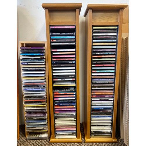 475 - Three contemporary CD racks with CDs