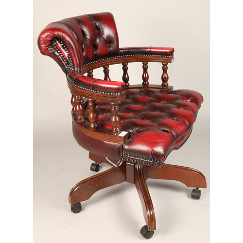 547 - Red leather Chesterfield-style captain's chair, approx. dimensions H 80cm, W 60cm, D 50cm