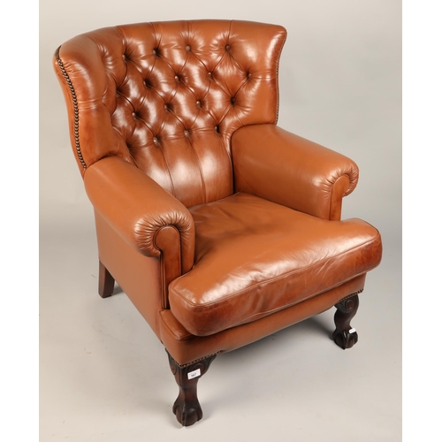 567 - Brown leather button back armchair, H 103cm, W 70cm, D 75cm