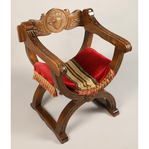 613 - Carved wooden curule chair