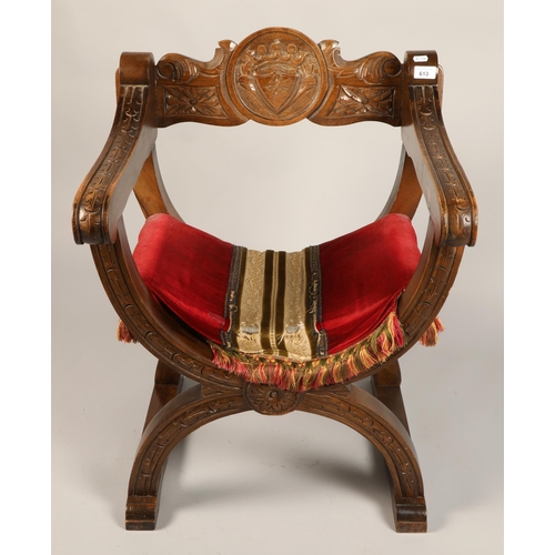 613 - Carved wooden curule chair