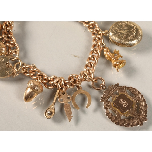 74 - 9ct gold charm bracelet, total weight 59.3g