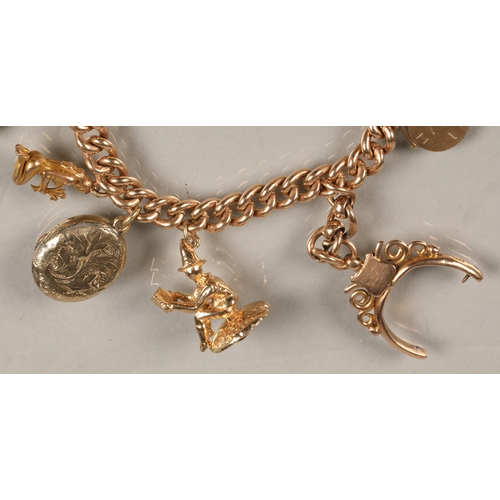 74 - 9ct gold charm bracelet, total weight 59.3g