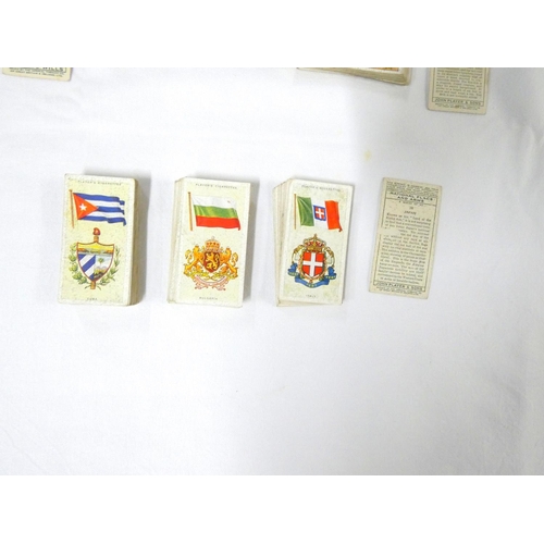 87 - Players cigarette cards including Treasure Trove, Churchman's, National Flags, Sea Fishes.