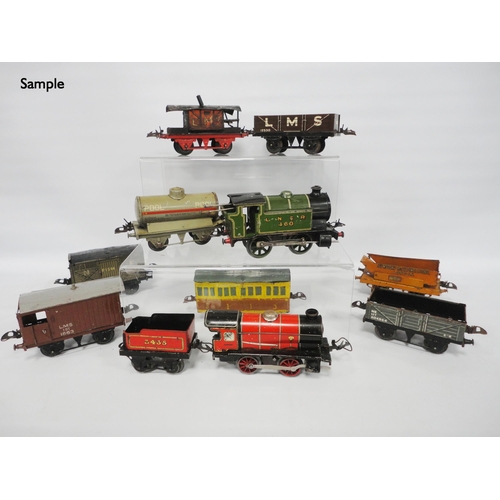 276 - Collection of Hornby by Meccano O gauge locomotives and carriages comprising two clock locomotives, ... 