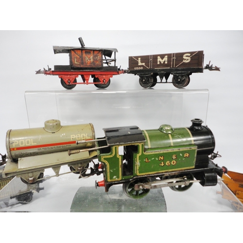 276 - Collection of Hornby by Meccano O gauge locomotives and carriages comprising two clock locomotives, ... 