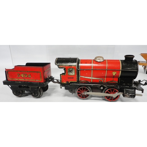 276 - Collection of Hornby by Meccano O gauge locomotives and carriages comprising two clock locomotives, ... 