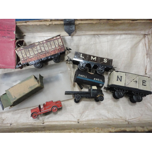 276 - Collection of Hornby by Meccano O gauge locomotives and carriages comprising two clock locomotives, ... 