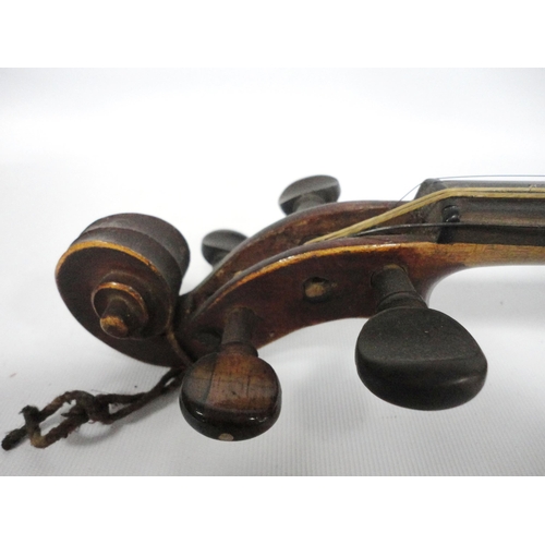 255 - Antique two-piece violin and bow, stamped Tourte to the bow, the ebony frog piece inlaid with mother... 