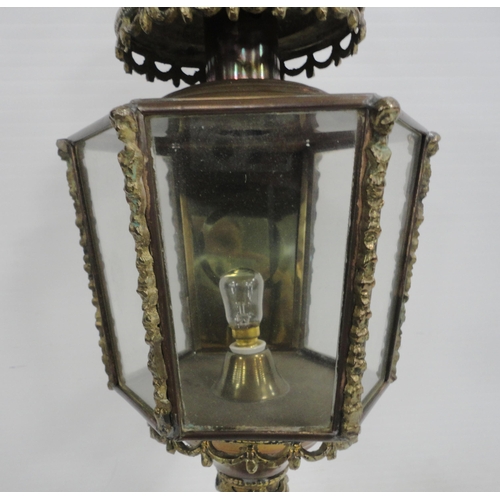 314 - Brass carriage lamp with eagle surmount and hexagonal glazed tapered sides, probably of German origi... 