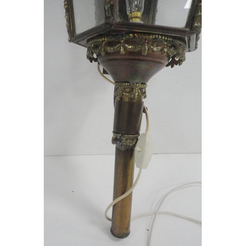 314 - Brass carriage lamp with eagle surmount and hexagonal glazed tapered sides, probably of German origi... 