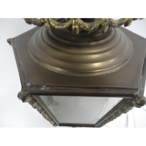 314 - Brass carriage lamp with eagle surmount and hexagonal glazed tapered sides, probably of German origi... 