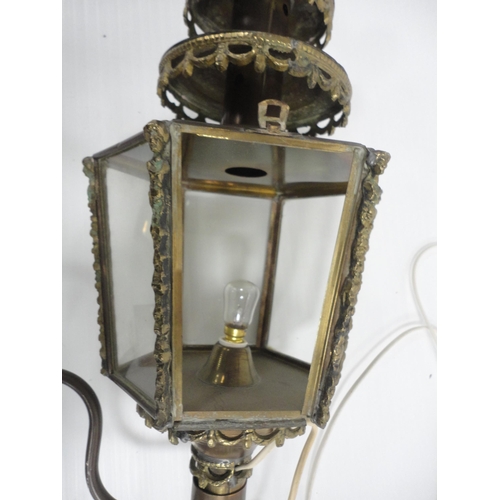 314 - Brass carriage lamp with eagle surmount and hexagonal glazed tapered sides, probably of German origi... 