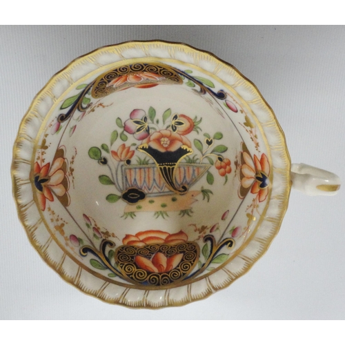 237 - Group of Derby-style 19th century teawares in the Imari palette comprising a cabinet cup and two sau... 