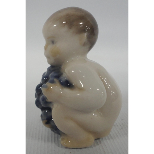 240 - Wilhelm Waldorf (1877 - 1935) for Royal CopenhagenPorcelain miniature model of a mermaid holding a f... 