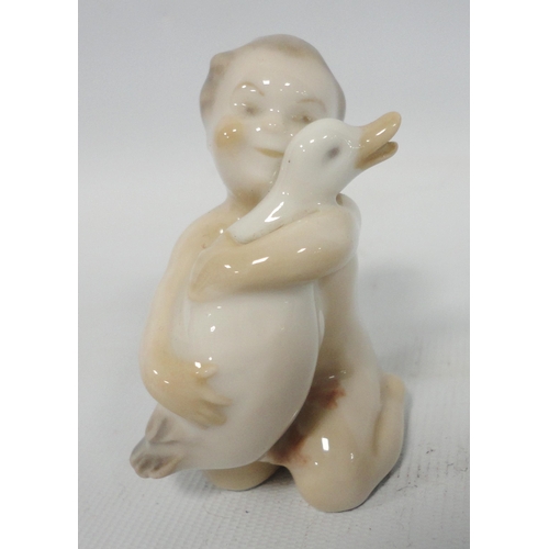 240 - Wilhelm Waldorf (1877 - 1935) for Royal CopenhagenPorcelain miniature model of a mermaid holding a f... 