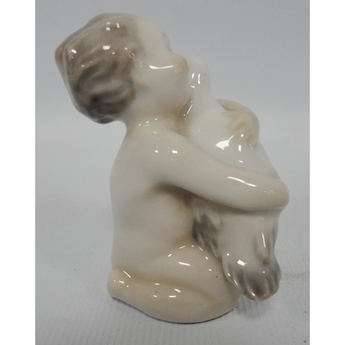 240 - Wilhelm Waldorf (1877 - 1935) for Royal CopenhagenPorcelain miniature model of a mermaid holding a f... 