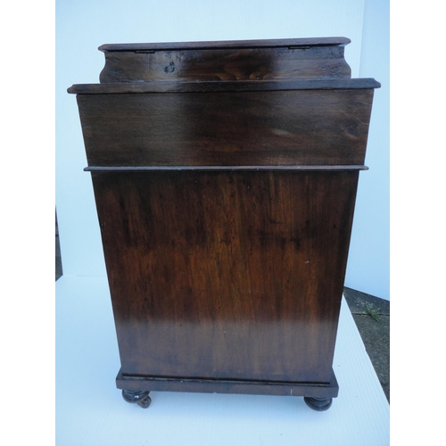 463 - Victorian mahogany davenport, the hinged desk stand above a flap enclosing bird's eye maple-lined dr... 