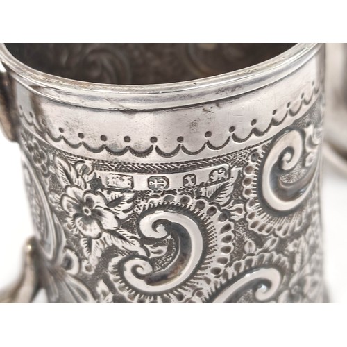 99 - Silver mug 1881 and another embossed, 1898. 263g, 8oz