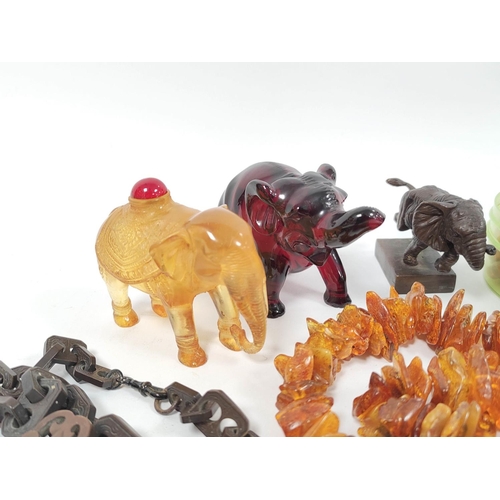 407 - Group of curios to include small bronzed figure of an elephant on plinth base, two modern amber colo... 