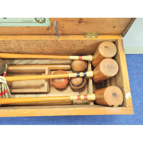 400 - The Original Croquet set by F.H Ayres - London, Housing mallets, balls etc, with original label to t... 