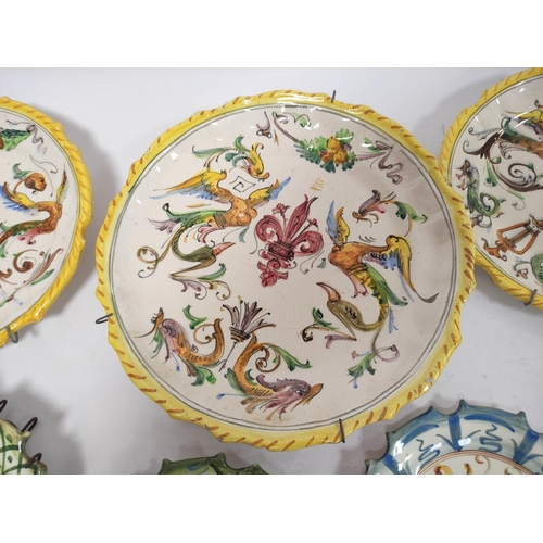 315 - Group of Italian majolica wall plates in the manner of Cantigalli, to include examples monogrammed F... 