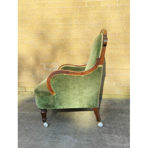 505 - Victorian mahogany framed armchair with shaped top rail and armrests, flanked with a scroll roundel,... 