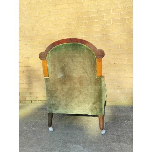 505 - Victorian mahogany framed armchair with shaped top rail and armrests, flanked with a scroll roundel,... 