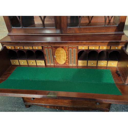 517 - Georgian mahogany secretaire bookcase, the bookcase top section with two astragal glazed doors enclo... 