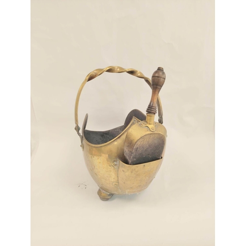 399 - Brass swing handle coal scuttle on bun feet with shovel.