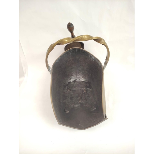 399 - Brass swing handle coal scuttle on bun feet with shovel.