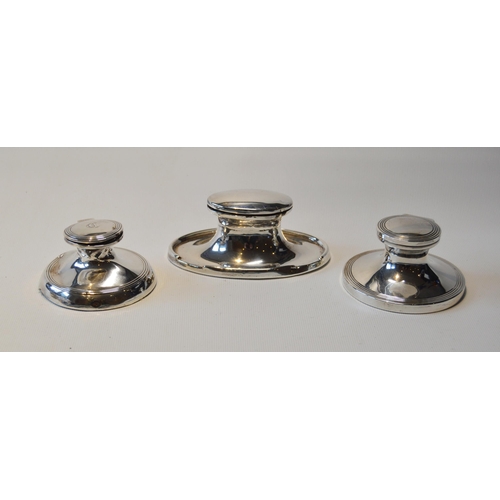 73 - Three silver capstan inkwells, various.