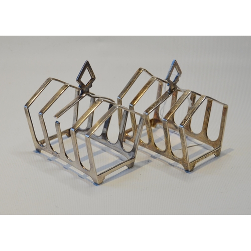 74 - Pair of silver Gothic-style five-bar toast racks, hallmarks for Birmingham 1931-32, 8cm x 8.5cm, 162... 