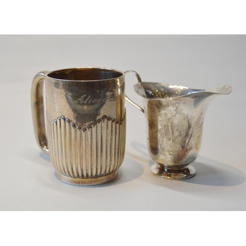 90 - Silver fluted christening mug, Birmingham 1903, and a small silver jug, 1927, 174g.