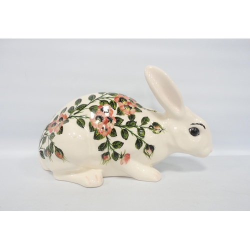 244 - Griselda Hill (Wemyss)Large figure of a rabbit decorated with underglazed wild roses, on green stalk... 